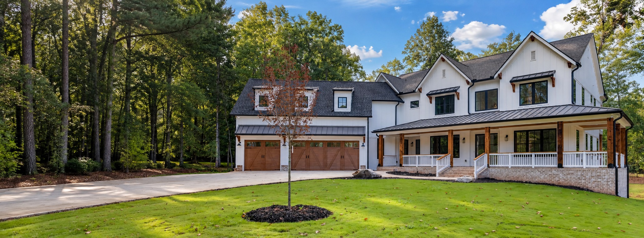 White custom home with welcoming front porch