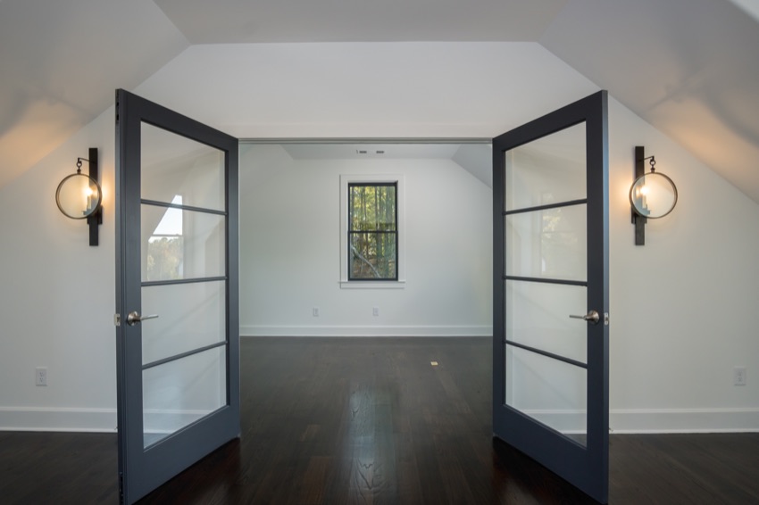Glass doors opening into a light-filled room