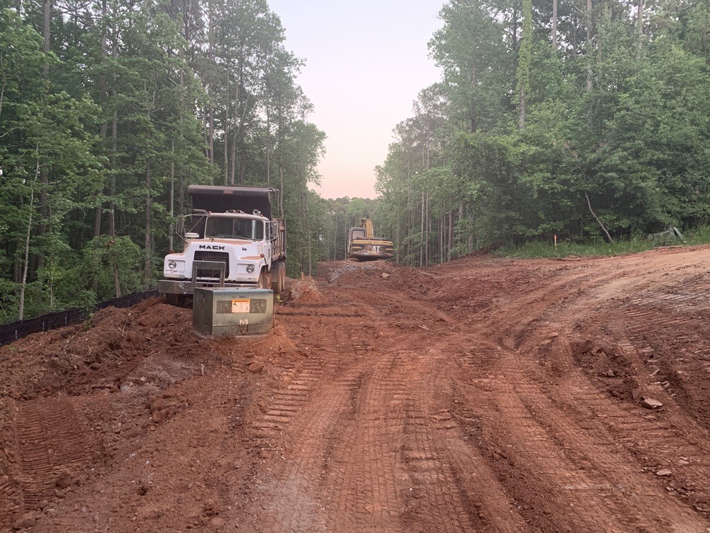 Equipment preparing a wooded property